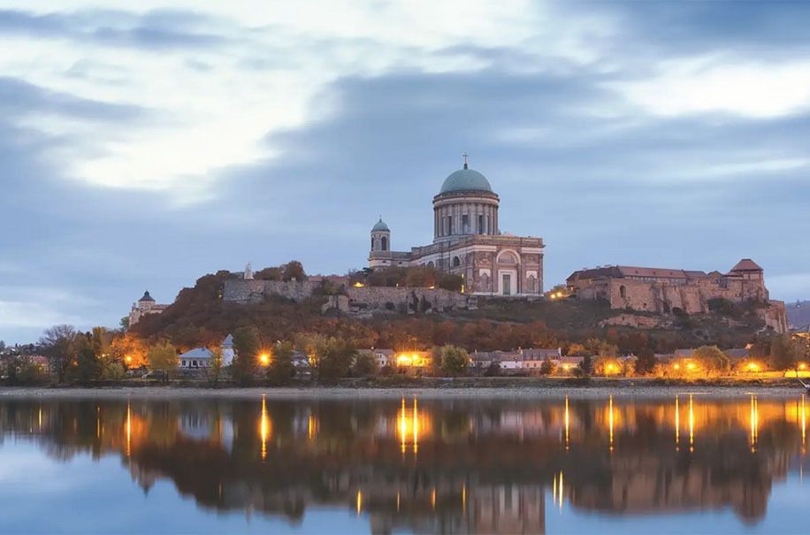 Esztergom Basilica lit at dusk above the Danube